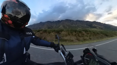 Motorbike rider and mountain side NZ