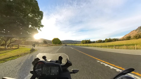 Sun out during motorbike ride Milford Sound