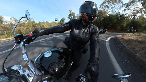 Lady rider cornering at Arthurs Seat, Mornington