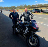 Two people in motorcycle leathers