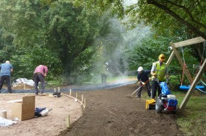 BLEC md Gary Mumby and the DIY SOS team preparing paths through the woodland at Little Miracles centre in Peterborough