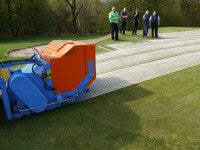 BLEC\'s new GKB Sandfiller in action at Crow Wood Golf Club, Muirhead, Scotland, watched by groundmen and greenkeepers