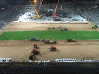 Fig 10; pitch laying continues through the night as the stage is dismantled.jpg