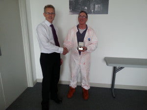 Kevin receiving his award from COO Peter Wood