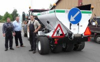 Jens Michael (centre) with customers and modified Dakota