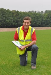 Speedcut contracts manager Kevin Smith on pitch one at Kings Hill, Kent, two weeks after seeding   Copy