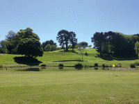 Across putting green to 9th