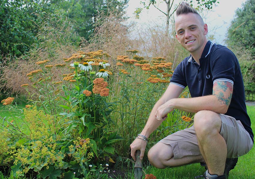 Lee Burkhill from BBC’s Garden Rescue tending to his garden