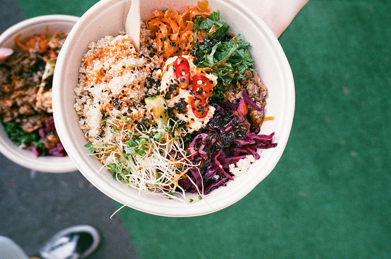 A bowl of colourful food, served outside