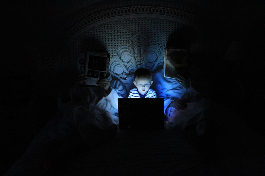 Family watching movie during power cut 