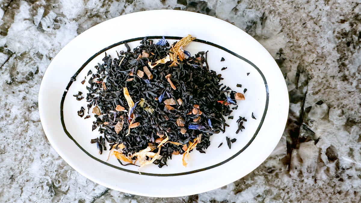 Cinnamon Nourish loose-leaf tea spread out on a plate.