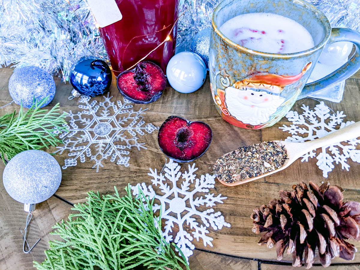 Snowflakes, baubles, pinecones and sugar plums make up this Christmas spread accompanying a Sugar Plum tea latte.