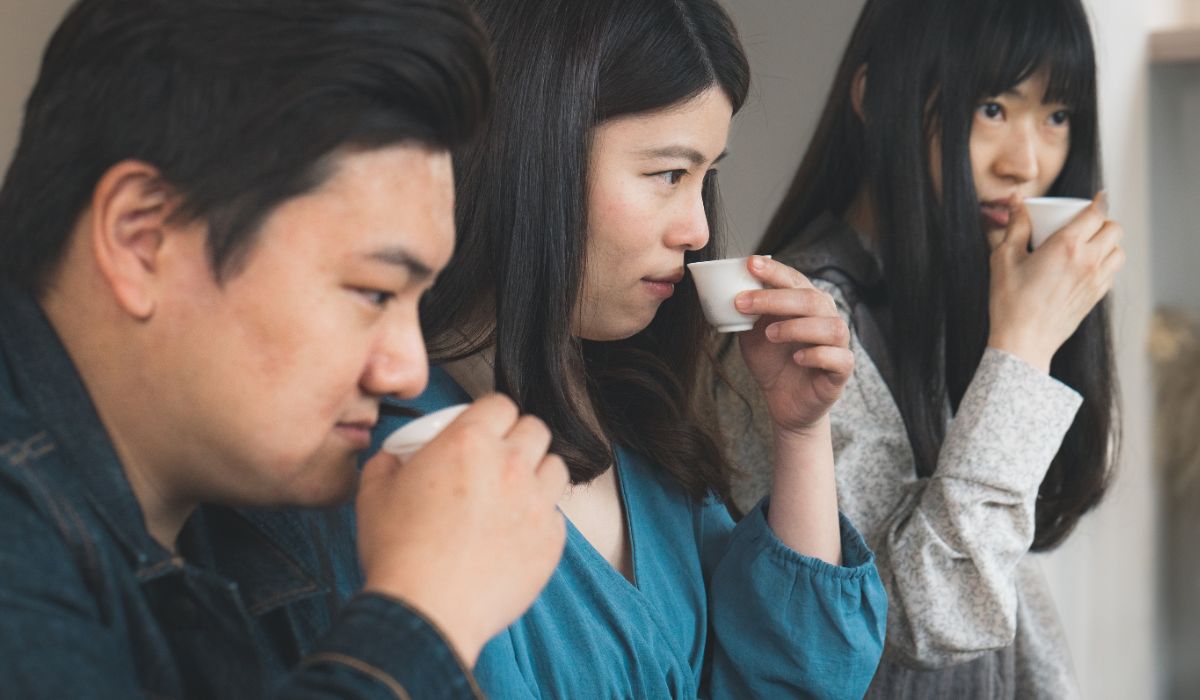 A cozy image of a tea tasting session, capturing the communal aspect of tea culture.