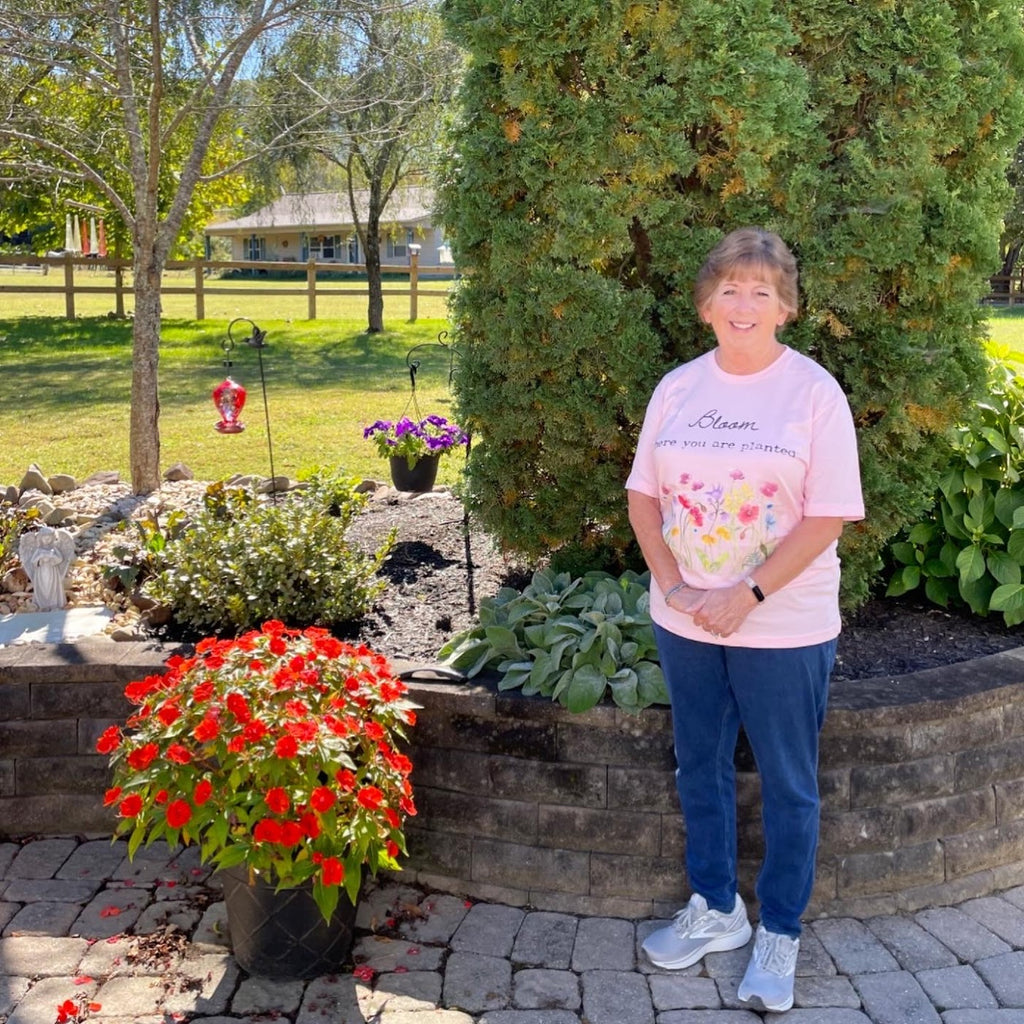 Mom wearing Bloom where you are planted t-shirt