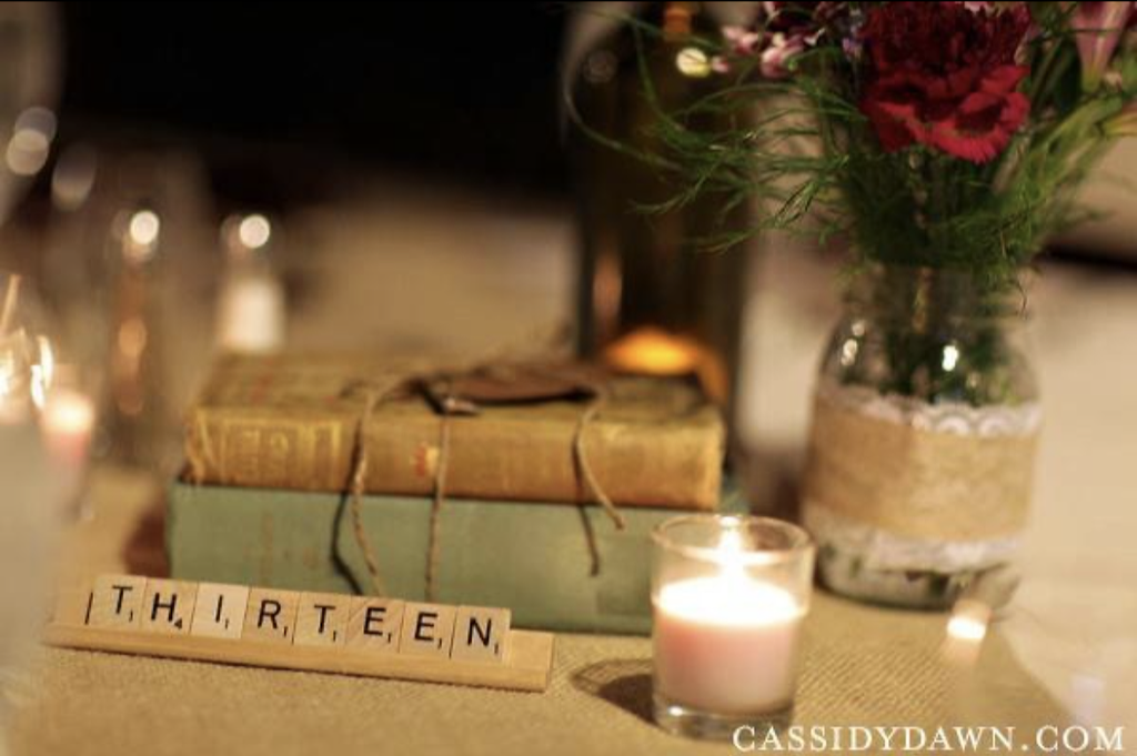 Antique books in wedding reception table centerpiece