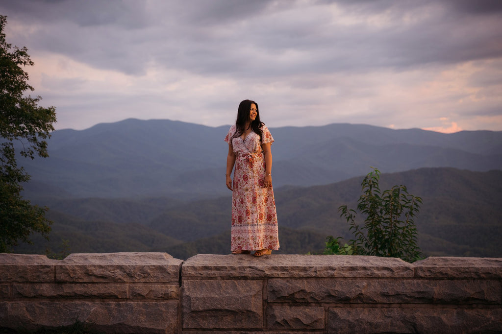 Alison Rose standing in front of mountains