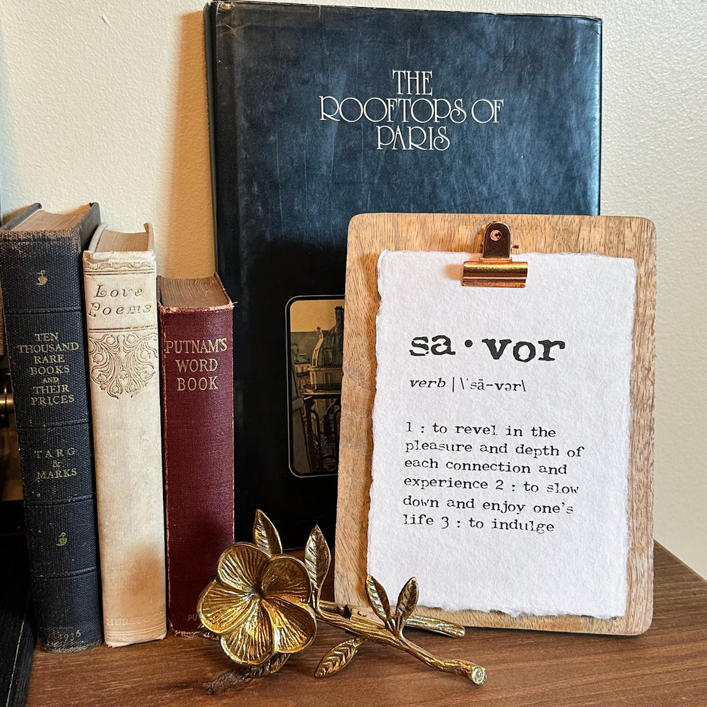 Savor definition print on a clip frame