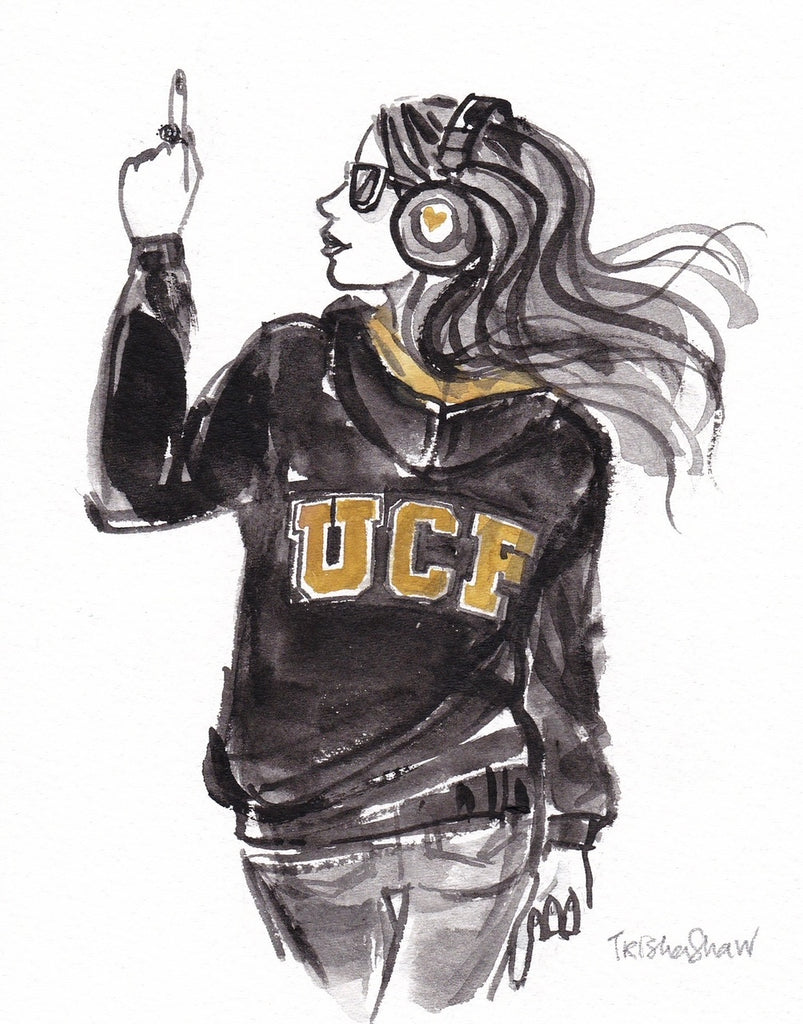 Woman pointing up wearing UCF hoodie