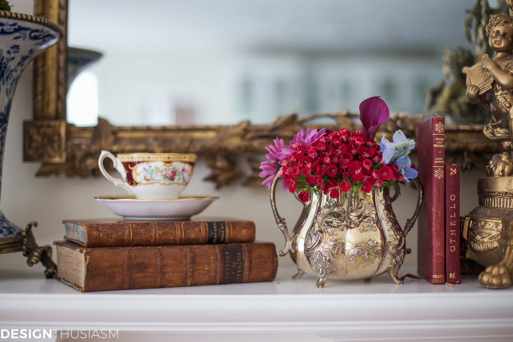 Fireplace mantel with antique books displayed