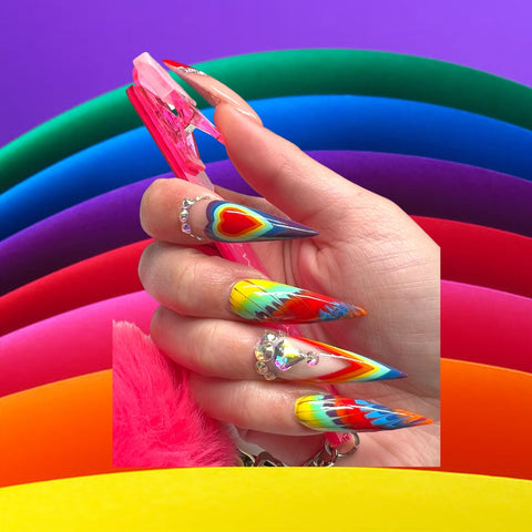 Premium Photo | A colorful nail art with a rainbow design on the nails.