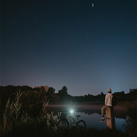 man watching the sky at night