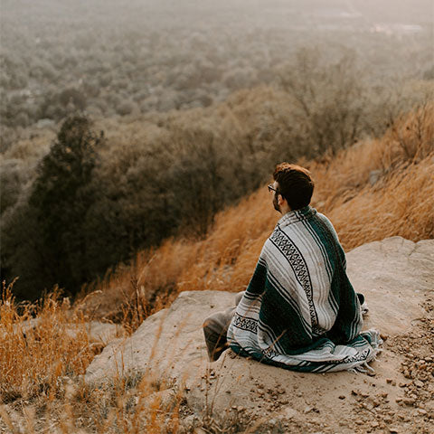 man using a ground blanket