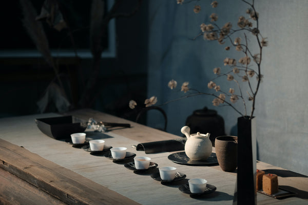 A row of teacups ready for tea tasting in an ambient environment 