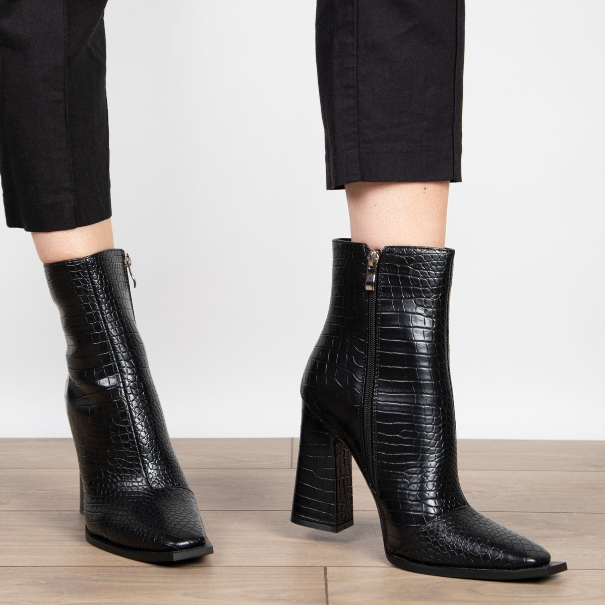 black heeled croc boots