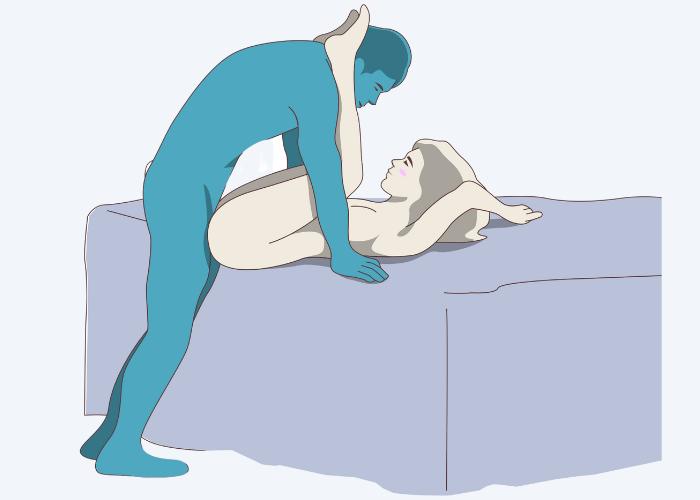 Illustration of the Giver standing, the receiver on the edge of the bed Sex Position