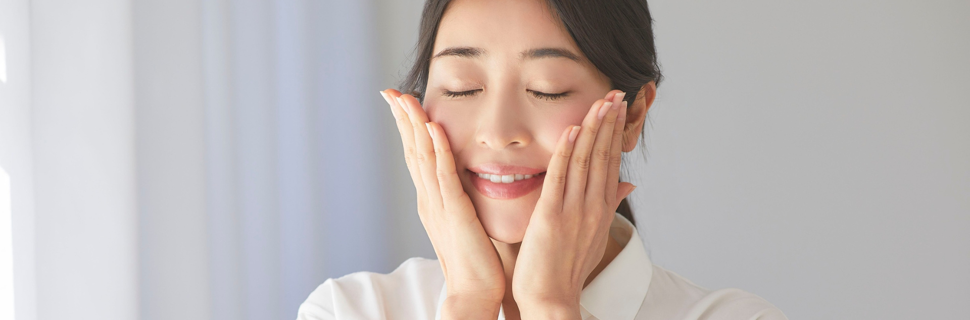 Woman enjoying summer glow with clear skin outdoors