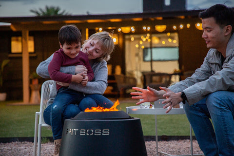 Family Surrounding Pit Boss Smokeless Fire Pit