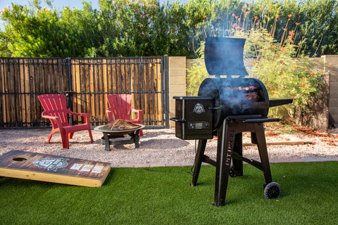 Pit Boss Pellet Grill Smoking in a Backyard