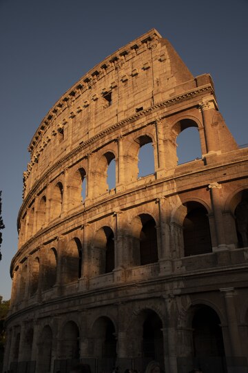 vertical-shot-famous-colosseum-rome-italy-sunset_181624-52589.jpg__PID:af52e7ae-383a-4000-b235-56fc96cce961