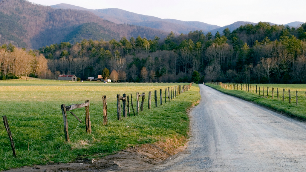 Cades Cove in the Smoky Mountains, inviting travelers to explore the scenic routes and discover things to do in the lush landscape.