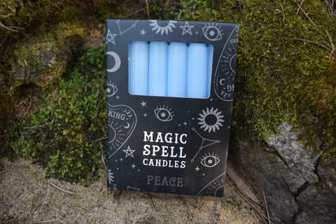 A packet of blue spell candles for peace