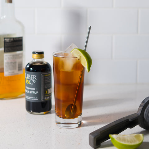 Homebar with makings of Cuba Libre cocktail