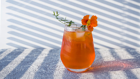 cocktail with a nasturtium flower