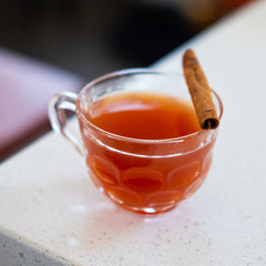 Blood Orange Canelazo on white countertop