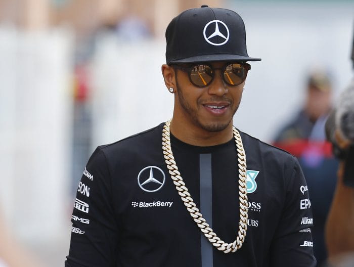 Lewis Hamilton Wears Louis Vuitton Souvenir Jacket and Sneakers at