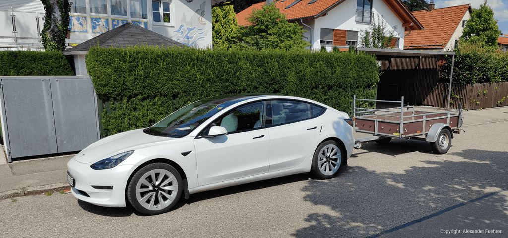 Tesla Model 3 towing a trailer