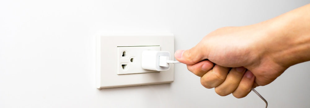a usb charger with wall power adapter, a hand