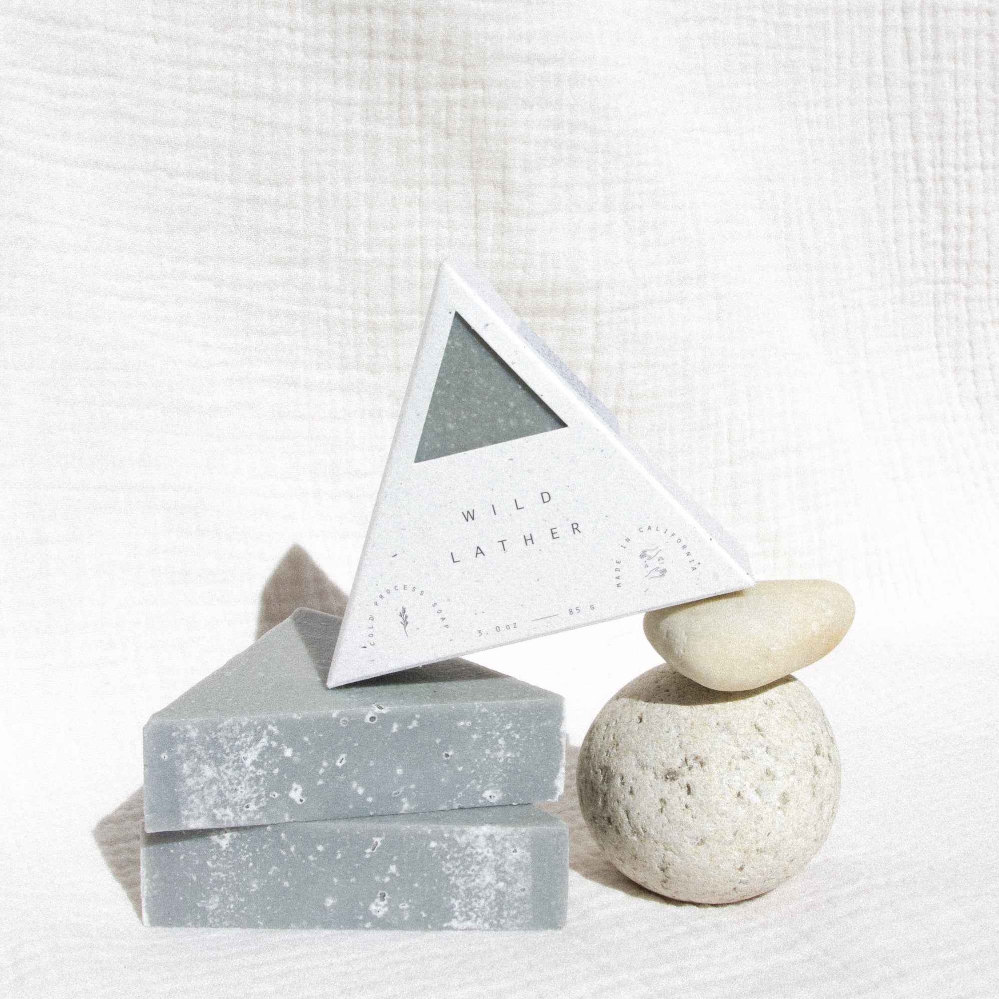 Three triangle soaps balancing with two stones