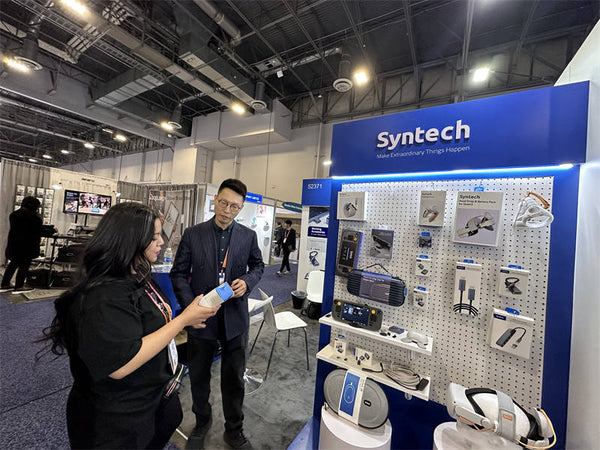 people visiting syntech desk