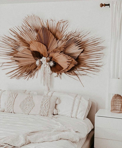 Dried palm installation wall arrangement for boho bedroom decor inspiration
