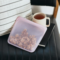 Pink food grade silicone sandwich bag used for snack and food on the go.