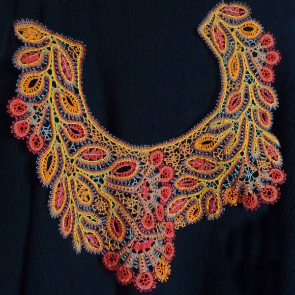 Beautiful lace color in red floral pattern created by bobbin lace artist Irina U.