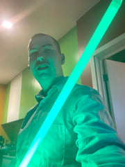 Brady posing with a lightsaber