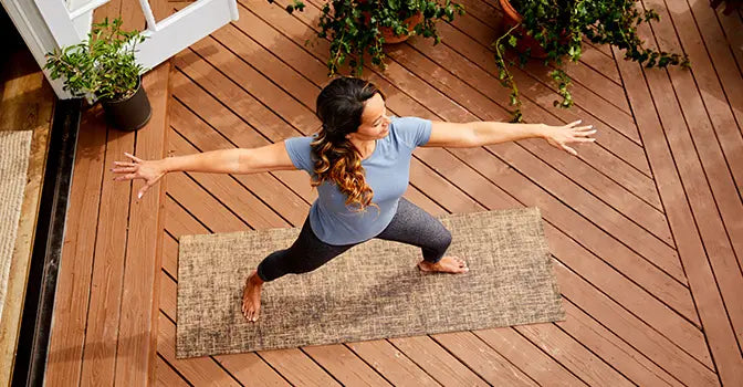 woman practicing yoga outdoors