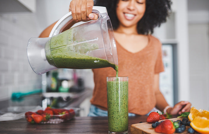 happy woman with healthy smoothie