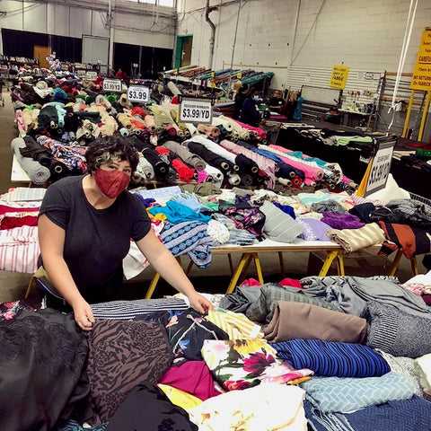 Ruby is rummaging through piles of remnants at her favorite fabric store.